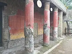 Still-standing columns with paint