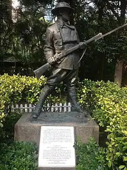 Statue of an anonymous World War I soldier from statuary collection of Eu Tong Sen. Also visible is the Battle of Hong Kong memorial plaque dedicated to all the defenders of Hong Kong in December 1941 through John Robert Osborn