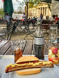 In Germany, the sausages from hot dogs are heated in a kettle of hot broth, but are also often grilled, then served in a crunchy bun. The German term for this grilled street food is "Bockwurst" or "Bratwurst im Brötchen."