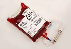 Image of blood bag labeled with blood type AB+
