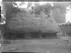 Igbo house with tower in the background