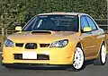 Subaru Impreza WRX STI spec C Type RA-R, a high-performance variant of the standard Subaru Impreza sedan. This photo shows the front of the car, which is yellow with white wheels.