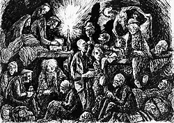 Many people clustered around a lit candle