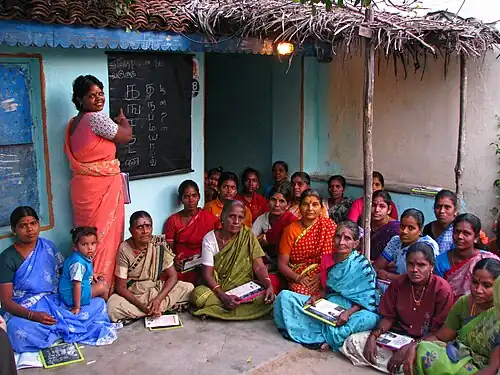 Women in sari at an adult literacy class in Tamil Nadu