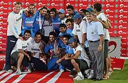 The Indian national cricket team posing with a cup after a series win