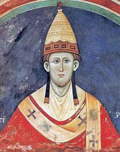 A middle-aged man wearing a papal triara