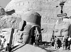 With the mountain cut away, workers began to dismantle the statues themselves, 1964