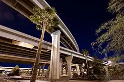 photo showing the multiple levels of roadways at the interchange between Interstates ten and seventeen, called "the stack" in downtown Phoenix at night.