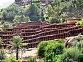 Racks for cylindrical clay hives at the Inzerki apiary, Morocco