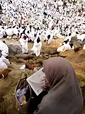 Mount Arafat during Ḥajj with Pilgrims supplicating.