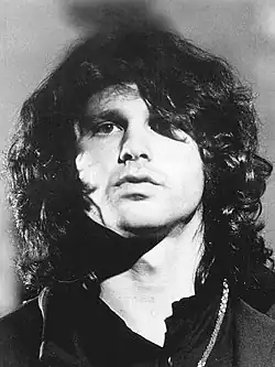 Photograph of Jim Morrison looking into the camera