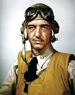 A US Navy pilot during World War II wearing an orange inflatable life jacket