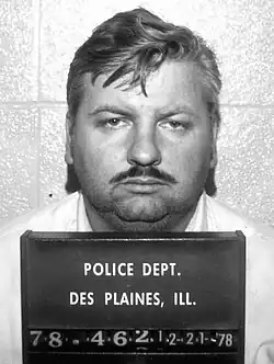 Black-and-white mugshot of Gacy facing forward