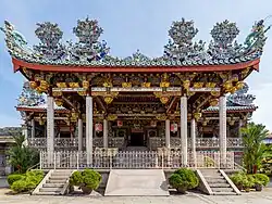 Front façade of a Chinese clan house featuring ornate carvings on the roof.