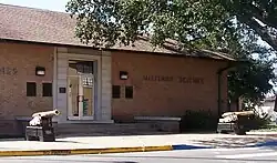 Two cannons in front of a building