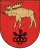 A coat of arms depicting a golden moose with large antlers and a protruding red tongue hovering over three black keys