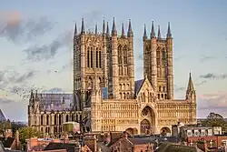 A view of the city of Lincoln showing the three towers of the cathedral rising high above the town