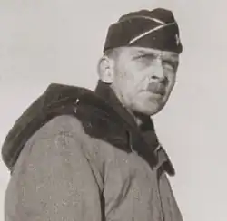 Brigadier General Lloyd E. Jones observes troops land at Amchitka Island during the Aleutians Campaign, shortly before assuming command of the 10th Light Division.