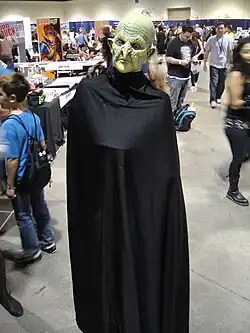 Person in a black witch costume at Long Beach Comic & Horror Con 2011