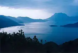 View of a lake from high up on one of its surrounding hills