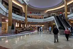 This three-story Macy's store (seen in 2025) located at The Mall at Millenia in Orlando, Florida, first opened in 2002 as part of the mall's grand opening. It was the first Macy's store to open in Central Florida, as all the other stores in the region were converted from Burdines. It was also one of seven Macy's stores in Florida (and the only one in Central Florida) that predated the Burdines–Macy's merger.