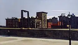 A cityscape with buildings and a bridge structure