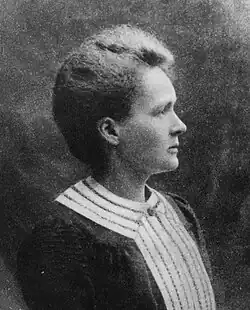 A black and white portrait of a woman in profile.