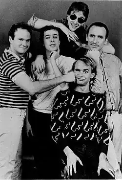 Men at Work in 1983 Top: John Rees; middle: Jerry Speiser, Ron Strykert, Colin Hay; bottom: Greg Ham