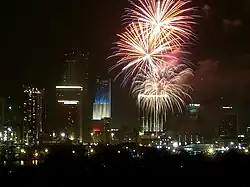 In addition to a fireworks show, Miami, Florida, lights one of its tallest buildings with the patriotic red, white and blue color scheme on Independence Day.