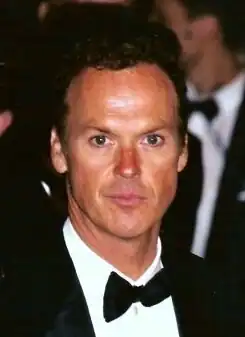 A formally-dressed Michael Keaton