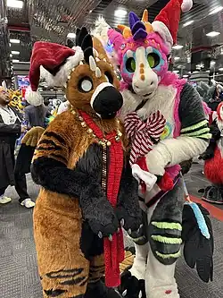 Two people wearing fursuits