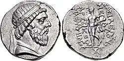Two sides of a coin. The side on the left showing the head of a bearded man, while the right a standing individual.