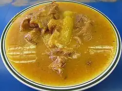 brownish soup with unidentified bits of meat in it