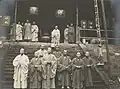 Buddhist monks on the steps of a temple building, 1908.