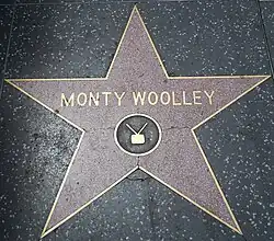 Monty Woolley's star featuring a television emblem