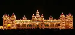 Golden 5-storey Mysore Palace building with 21 domed towers and central spire