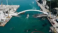 A broken bridge, which has fallen into the water over which it used to pass