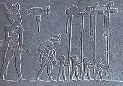 Narmer, a Predynastic ruler, accompanied by men carrying the standards of various local gods