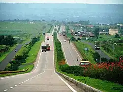 Landscaped four-lane road over rolling terrain