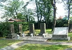 Memorial stones and a plaque describing the Battle of Noheji