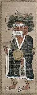 Oni in pilgrim's clothing. Tokugawa period. Hanging scroll, ink and color on paper. 59.2 by 22.1 centimetres (23.3&nbsp;in ×&nbsp;8.7&nbsp;in)