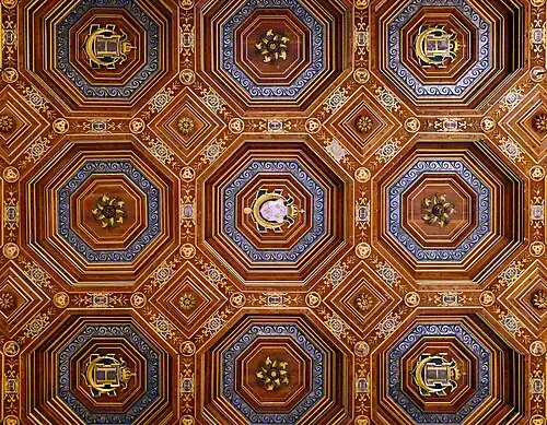 The ceiling of the ballroom, designed by Philibert de l'Orme, with the symbols of Henri II and his mistress Diane de Poitiers: "HD" cyphers, three interlaced crescent moons, and Henri II's main cypher: a crowned H above a crescent moon