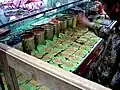 Shopkeeper making paan in an Indian store