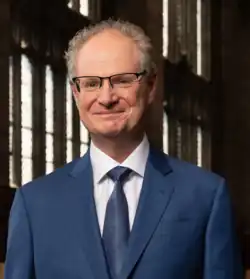 A professional photo of Paul Alivisatos smiling at the camera