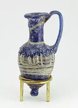Ancient Egyptian perfume vase in shape of an amphoriskos; 664–630&nbsp;BC; glass: 8&nbsp;cm ×&nbsp;4&nbsp;cm (3.1&nbsp;in ×&nbsp;1.6&nbsp;in); Metropolitan Museum of Art (New York City)