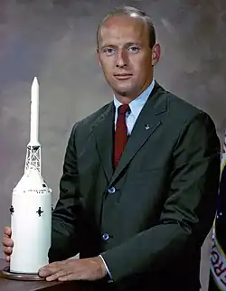 Head shot of Conrad wearing a red necktie