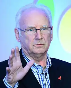 Photograph of Pete Waterman, an elderly Caucasian man with white hair, wearing a suit