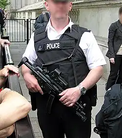 Police officer from Met police London England UK at Downing Street security holding an MP5SFA3.
