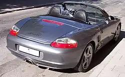 Porsche Boxster circa 2004, with detachable clear plastic windblocker and a Z-fold top[63]