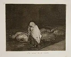 A woman walks from right to left, past dozens of bodies awaiting burial. Her face and body are covered with a protective shawl.